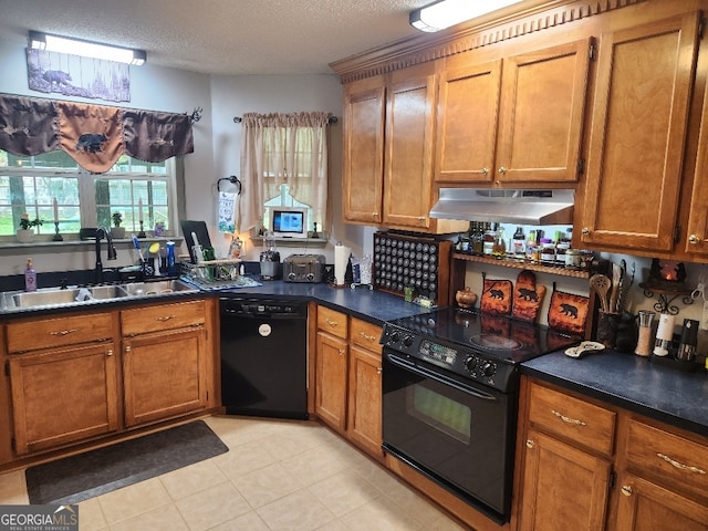 115 Settlers Trl, Warner Robins, GA 31088 - kitchen with black appliances, under cabinet range hood, brown cabinets, and a textured ceiling