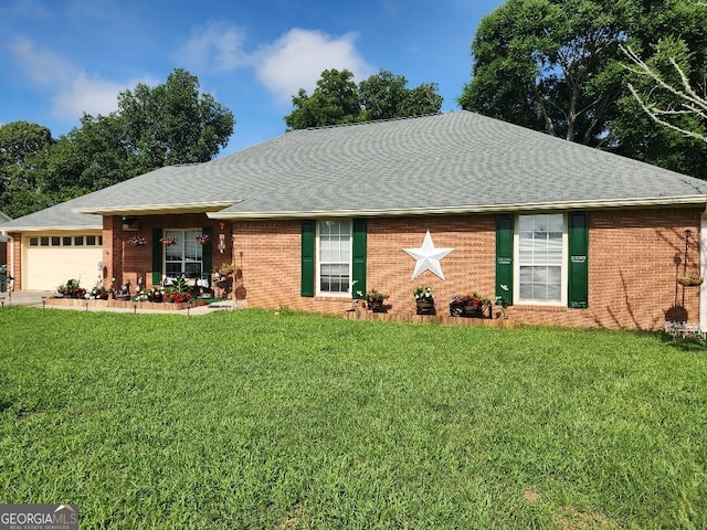 115 Settlers Trl, Warner Robins, GA 31088 - ranch-style house with a front yard, brick siding, an attached garage, and a shingled roof
