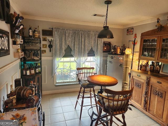 115 Settlers Trl, Warner Robins, GA 31088 - dining room featuring light tile patterned flooring and a textured ceiling