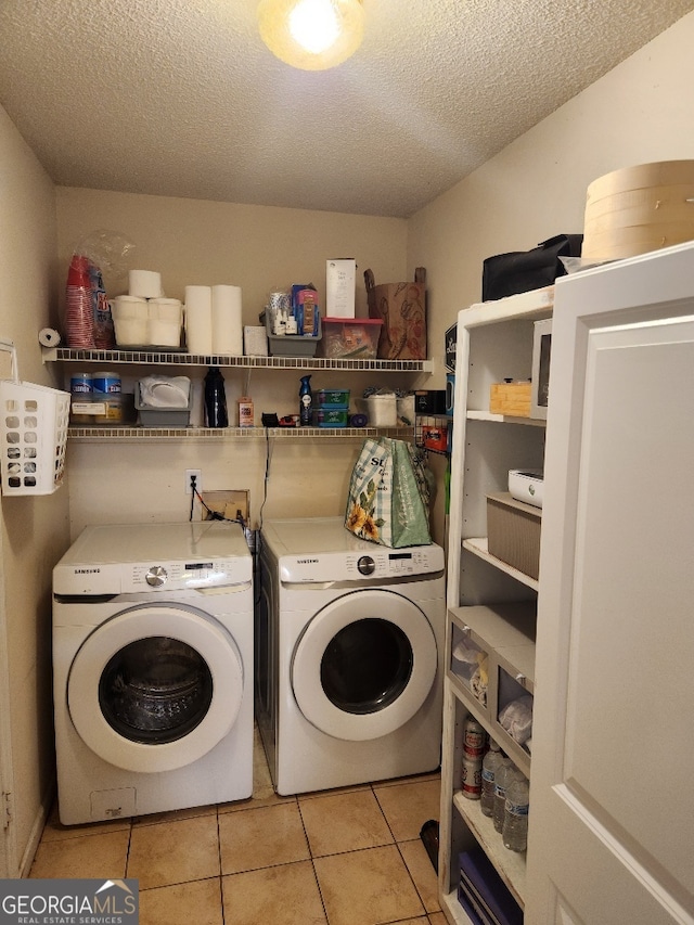 115 Settlers Trl, Warner Robins, GA 31088 - laundry room with separate washer and dryer, a textured ceiling, and light tile patterned floors