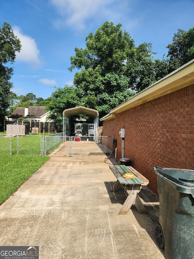 115 Settlers Trl, Warner Robins, GA 31088 - view of parking / parking lot with a carport