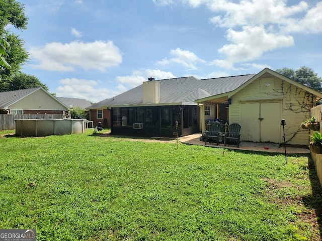 115 Settlers Trl, Warner Robins, GA 31088 - rear view of property featuring a sunroom, a chimney, a yard, and cooling unit