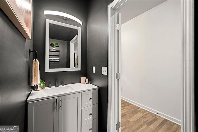 4992 Lower Elm, Atlanta, GA 30349 - bathroom featuring vanity and wood finished floors