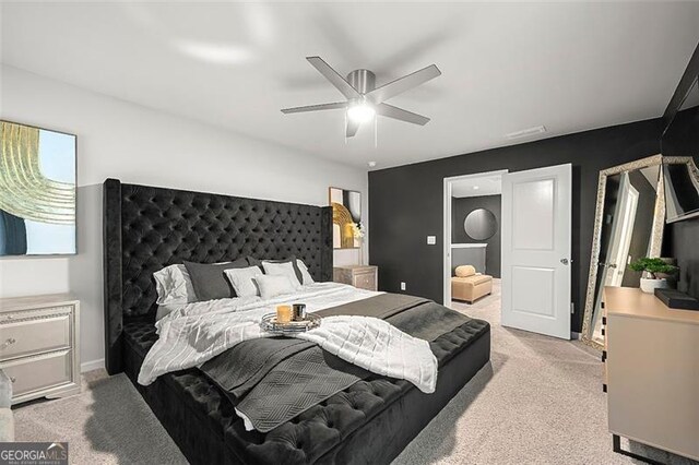 4992 Lower Elm, Atlanta, GA 30349 - bedroom featuring light colored carpet and ceiling fan