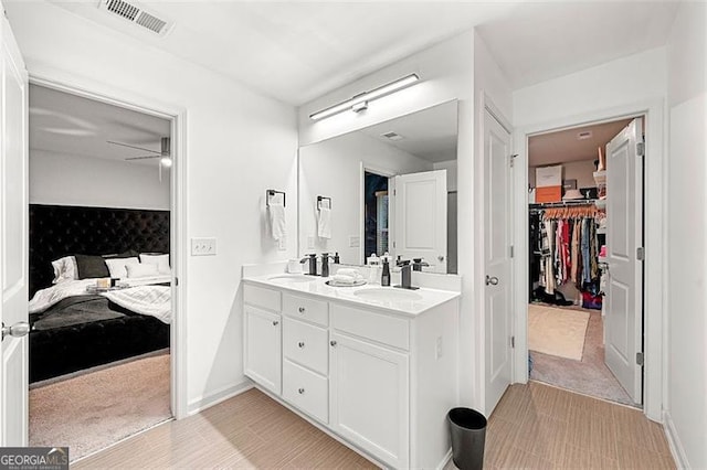 4992 Lower Elm, Atlanta, GA 30349 - bathroom featuring ensuite bathroom, double vanity, and a spacious closet
