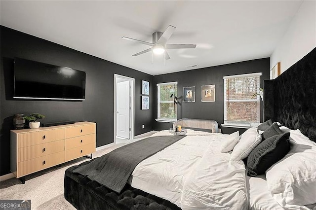 4992 Lower Elm, Atlanta, GA 30349 - bedroom with light carpet and ceiling fan