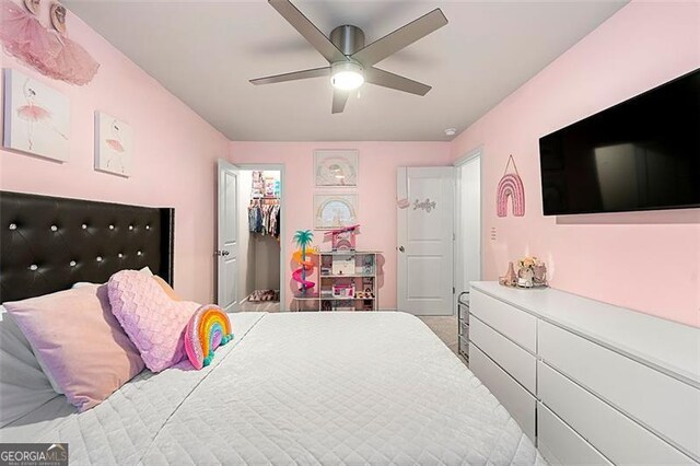 4992 Lower Elm, Atlanta, GA 30349 - bedroom featuring ceiling fan, a spacious closet, and a closet