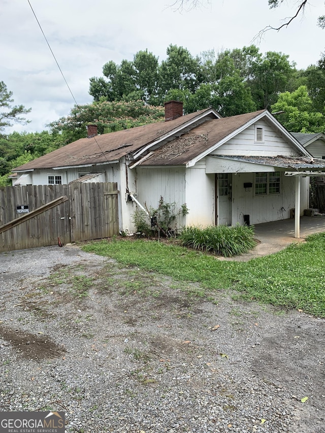 2712 Maple Rd SE, Rome, GA 30161 - view of home's exterior with a chimney