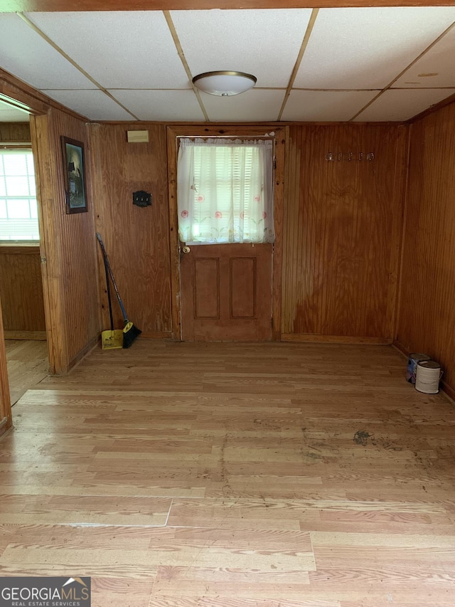 2712 Maple Rd SE, Rome, GA 30161 - entrance foyer featuring light wood finished floors, a paneled ceiling, and wood walls