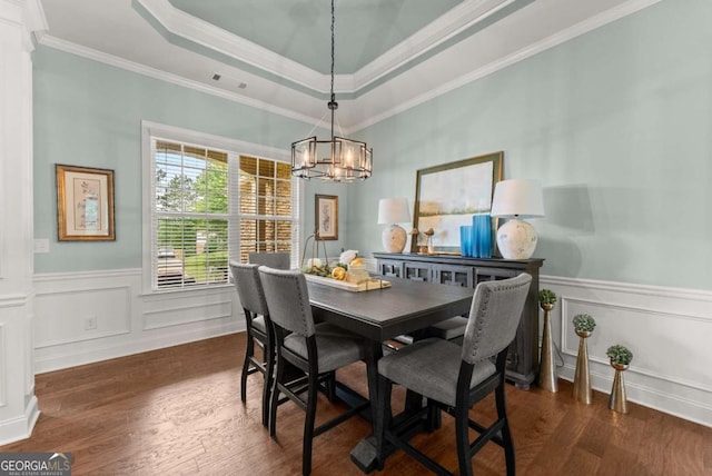 6460 Valley Crossing Way, Cumming, GA 30028 - dining room with ornamental molding, dark wood-type flooring, a chandelier, wainscoting, and a tray ceiling