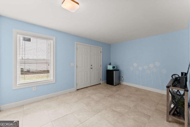 6460 Valley Crossing Way, Cumming, GA 30028 - unfurnished bedroom with baseboards and a closet