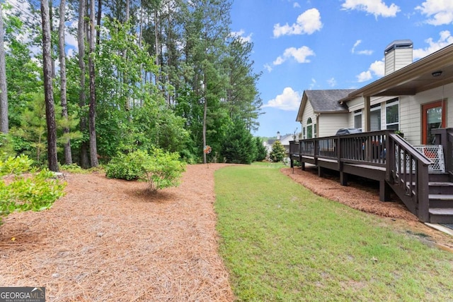 6460 Valley Crossing Way, Cumming, GA 30028 - view of grassy yard with a wooden deck