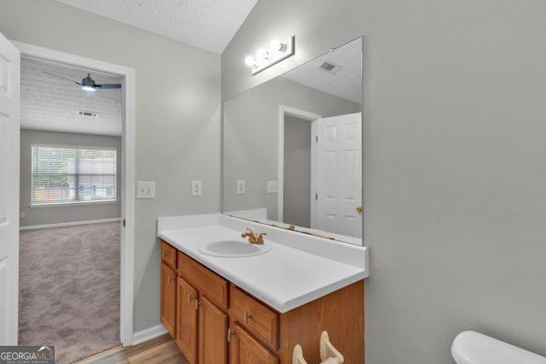7770 Hana Ct, Jonesboro, GA 30236 - half bathroom featuring vanity and toilet