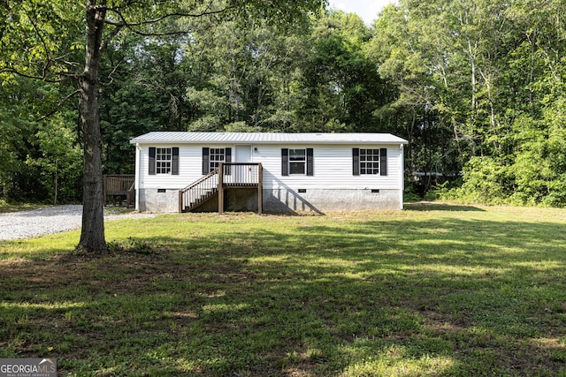 179 Autumnwood Way, Cleveland, GA 30528 - view of front of house featuring crawl space, a front yard, a metal roof, and a wooded view