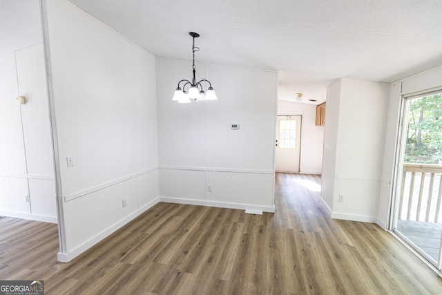 179 Autumnwood Way, Cleveland, GA 30528 - unfurnished dining area with a chandelier and wood finished floors