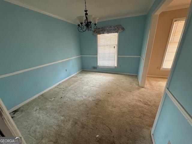 3415 Spring Valley Blvd, South Fulton, GA 30349 - empty room featuring crown molding, a chandelier, and carpet flooring