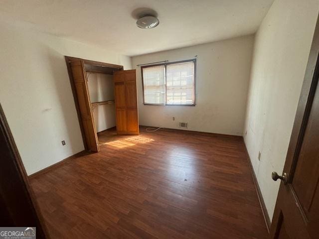 3415 Spring Valley Blvd, South Fulton, GA 30349 - unfurnished bedroom featuring wood finished floors and a closet