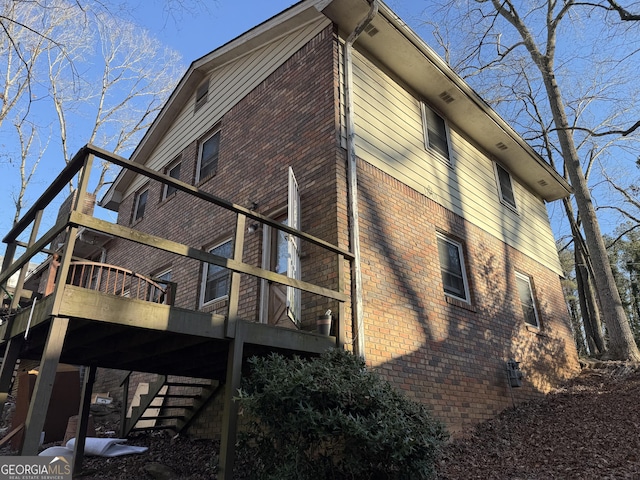 3415 Spring Valley Blvd, South Fulton, GA 30349 - view of home's exterior with brick siding and a deck