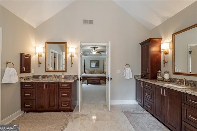 660 Glendalough Ct, Alpharetta, GA 30004 - bathroom with two vanities, high vaulted ceiling, a ceiling fan, marble finish floors, and ensuite bath