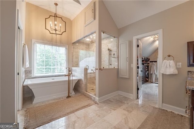 660 Glendalough Ct, Alpharetta, GA 30004 - bathroom with vaulted ceiling, a freestanding tub, a stall shower, vanity, and a chandelier