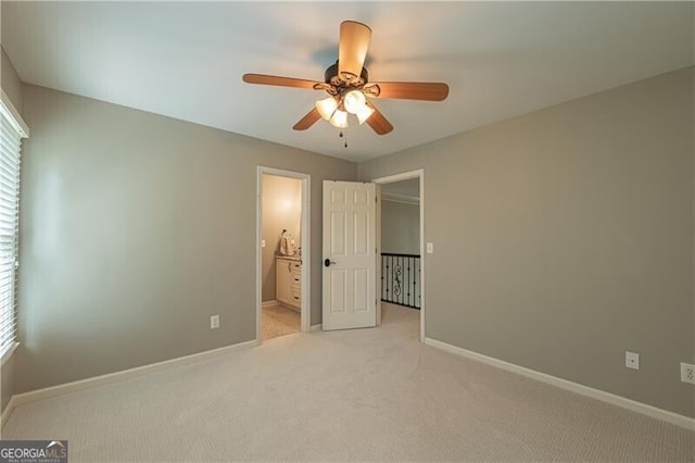 660 Glendalough Ct, Alpharetta, GA 30004 - unfurnished bedroom featuring light carpet, multiple windows, ensuite bath, and a ceiling fan