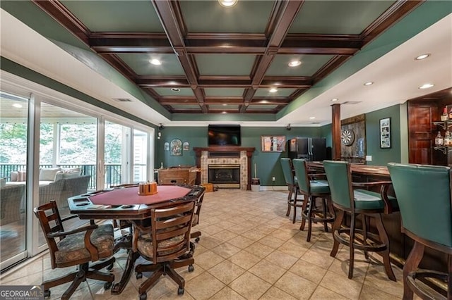660 Glendalough Ct, Alpharetta, GA 30004 - dining area with coffered ceiling, crown molding, a fireplace, beamed ceiling, and light tile patterned floors