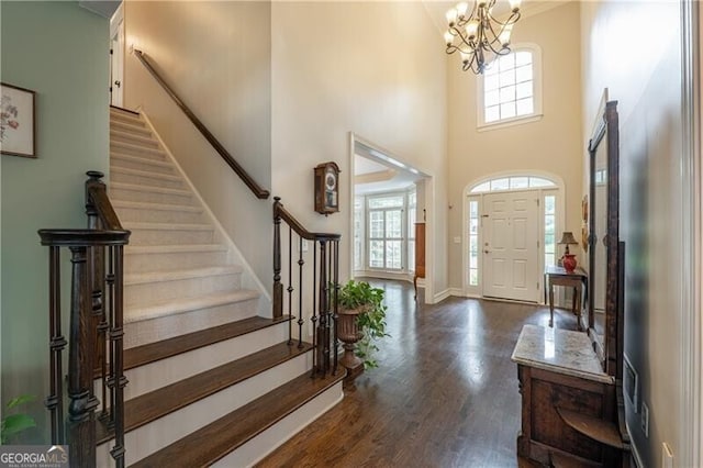 660 Glendalough Ct, Alpharetta, GA 30004 - foyer featuring stairway, dark wood-style floors, a chandelier, and a high ceiling