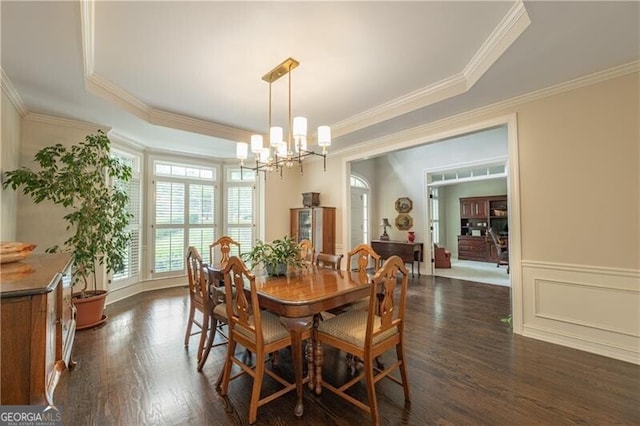 660 Glendalough Ct, Alpharetta, GA 30004 - dining room with a chandelier, dark wood-style flooring, ornamental molding, and a tray ceiling