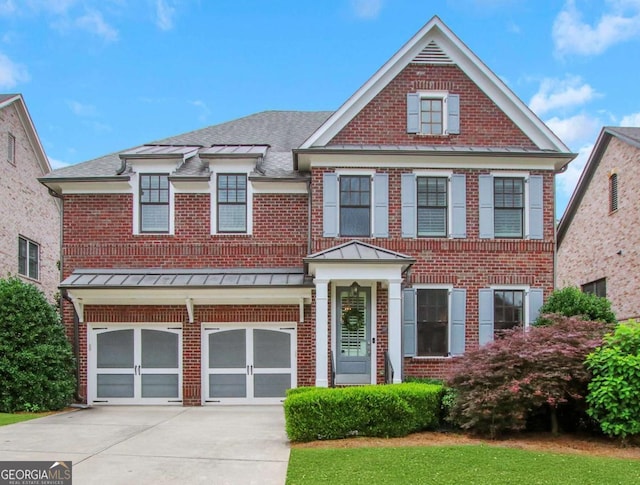 3467 Brookleigh Ln NE, Atlanta, GA 30319 - view of front of home featuring brick siding, a standing seam roof, and a garage