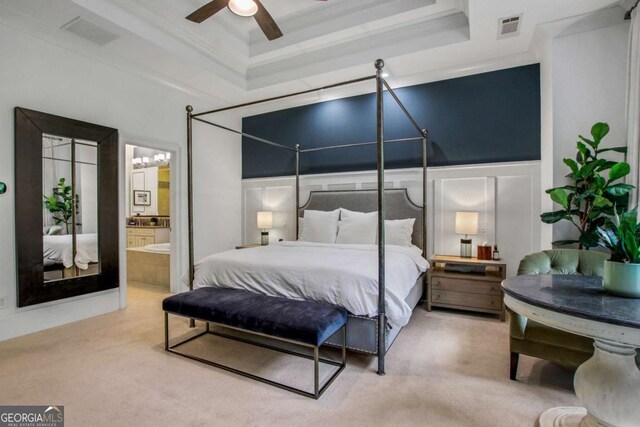 3467 Brookleigh Ln NE, Atlanta, GA 30319 - carpeted bedroom with a tray ceiling, crown molding, and connected bathroom