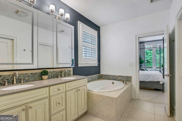 3467 Brookleigh Ln NE, Atlanta, GA 30319 - full bath featuring double vanity, a garden tub, ensuite bath, tile patterned flooring, and backsplash