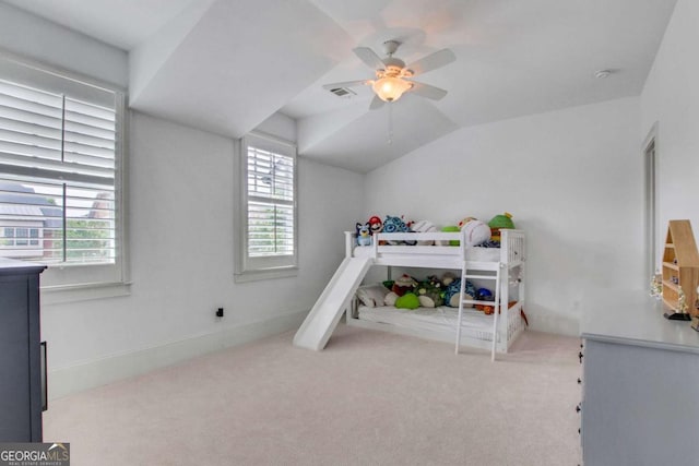 3467 Brookleigh Ln NE, Atlanta, GA 30319 - carpeted bedroom featuring multiple windows, lofted ceiling, and ceiling fan