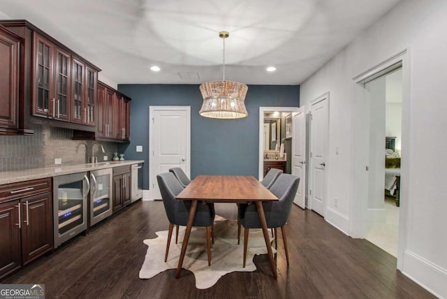 3467 Brookleigh Ln NE, Atlanta, GA 30319 - dining room featuring beverage cooler, recessed lighting, dark wood finished floors, and a chandelier