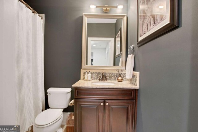 3467 Brookleigh Ln NE, Atlanta, GA 30319 - full bath with decorative backsplash, vanity, and a shower with shower curtain