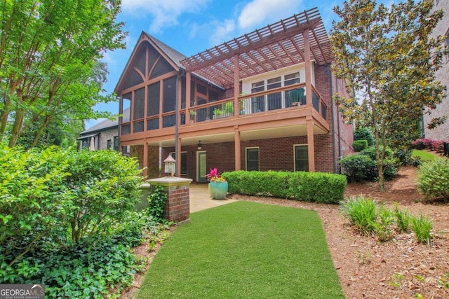 3467 Brookleigh Ln NE, Atlanta, GA 30319 - back of house with brick siding, a pergola, a sunroom, a lawn, and ceiling fan