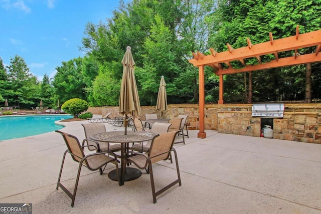 3467 Brookleigh Ln NE, Atlanta, GA 30319 - view of patio featuring area for grilling, an outdoor pool, view of scattered trees, and outdoor dining space