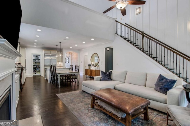3467 Brookleigh Ln NE, Atlanta, GA 30319 - living room featuring a fireplace, dark wood finished floors, a ceiling fan, recessed lighting, and stairway