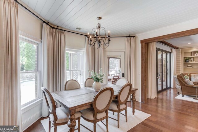 120 Slate Dr, Buford, GA 30518 - dining space with a chandelier, wood finished floors, and wooden ceiling