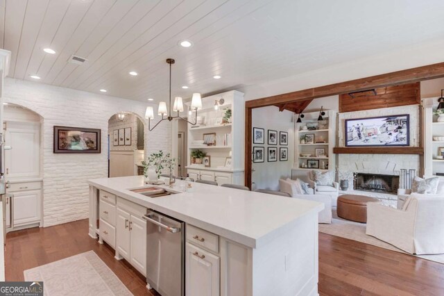 120 Slate Dr, Buford, GA 30518 - kitchen with dishwasher, white cabinetry, a fireplace, light countertops, and dark wood finished floors