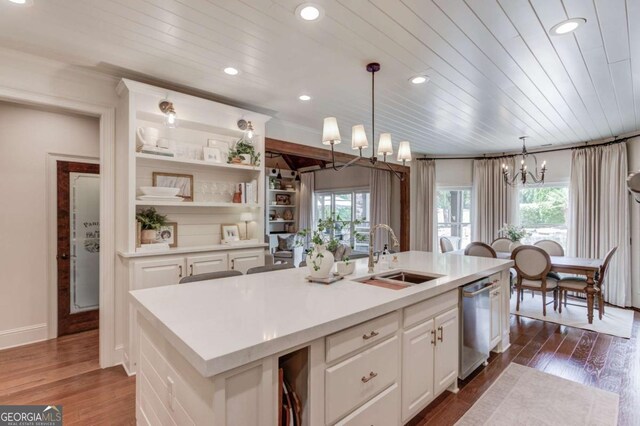 120 Slate Dr, Buford, GA 30518 - kitchen featuring stainless steel dishwasher, a chandelier, white cabinetry, light countertops, and wooden ceiling