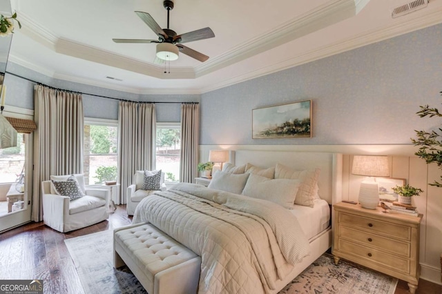 120 Slate Dr, Buford, GA 30518 - bedroom featuring a tray ceiling, wood finished floors, ornamental molding, and ceiling fan