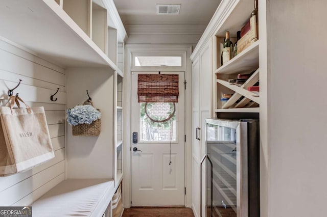 120 Slate Dr, Buford, GA 30518 - mudroom with ornamental molding, wood finished floors, a bar, and beverage cooler