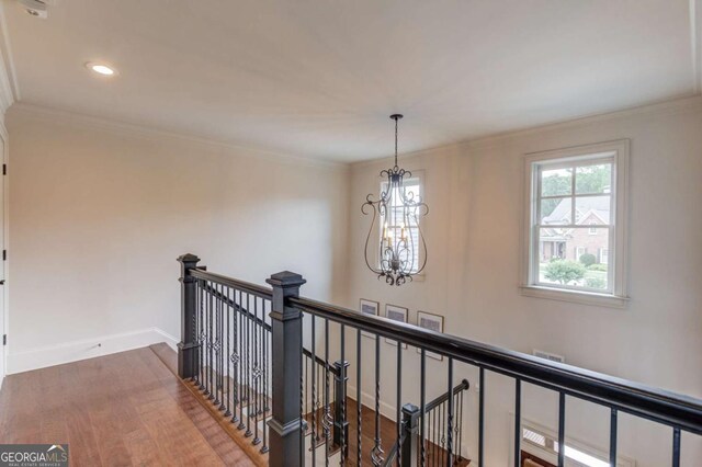 120 Slate Dr, Buford, GA 30518 - hallway featuring an upstairs landing, a chandelier, wood finished floors, crown molding, and recessed lighting