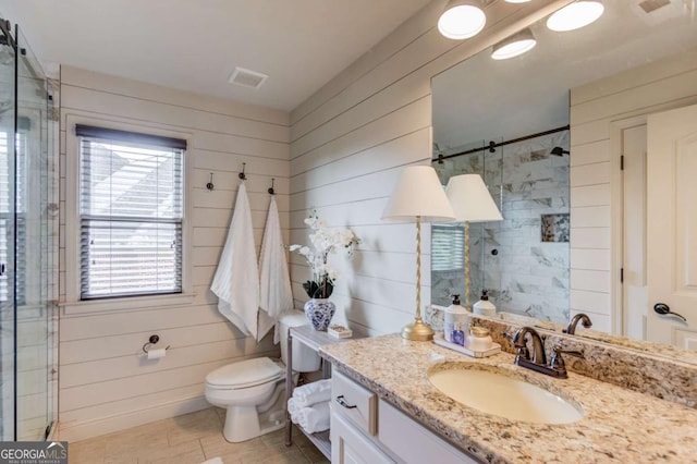 120 Slate Dr, Buford, GA 30518 - full bathroom with a stall shower, vanity, and wood walls