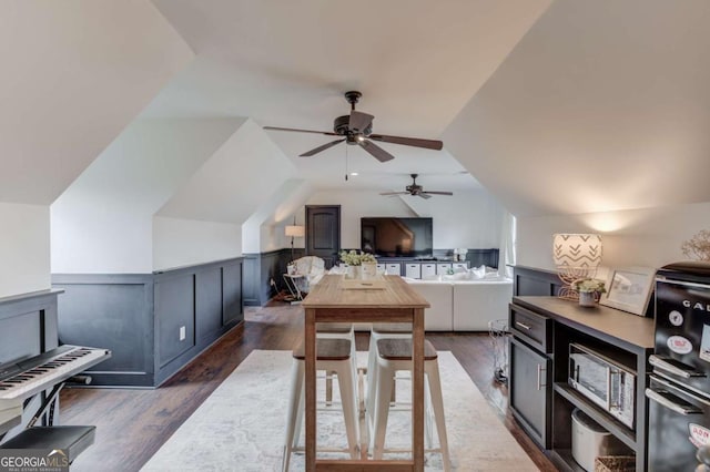 120 Slate Dr, Buford, GA 30518 - dining area featuring a ceiling fan, dark wood finished floors, a wainscoted wall, and lofted ceiling