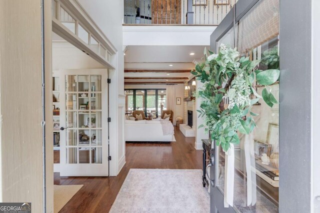 120 Slate Dr, Buford, GA 30518 - foyer entrance featuring wood finished floors, french doors, and a large fireplace