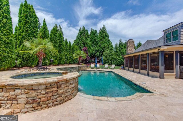 120 Slate Dr, Buford, GA 30518 - view of swimming pool with a sunroom, a patio area, and a pool with connected hot tub