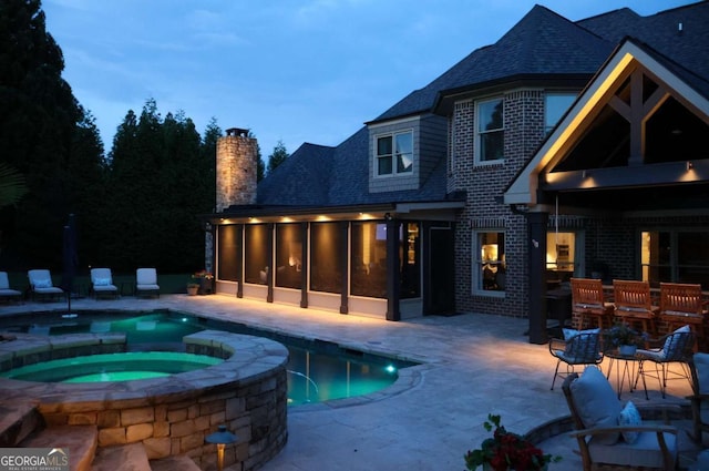 120 Slate Dr, Buford, GA 30518 - view of swimming pool featuring a sunroom, a patio, and a pool with connected hot tub