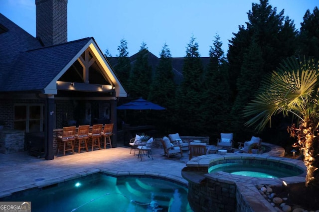 120 Slate Dr, Buford, GA 30518 - outdoor pool featuring an in-ground hot tub, a patio, an outdoor structure, and an exterior structure