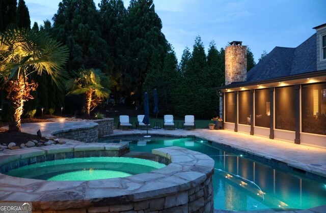 120 Slate Dr, Buford, GA 30518 - view of swimming pool featuring a pool with connected hot tub, a sunroom, and a patio area